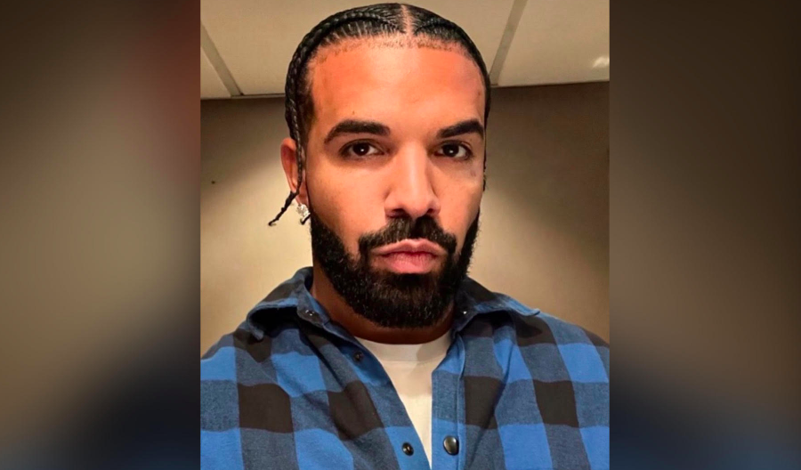 Drake is seemingly under fire after linking up with 11-year-old upcoming rapper FNG King as seen in a short viral clip. Fans speculate the location to be a night club although it hasn't been confirmed.